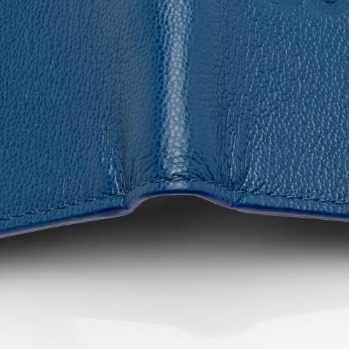 Burberry Embossed Grainy Calfskin Bi-Fold Wallet